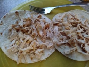 Chicken placed on tortillas